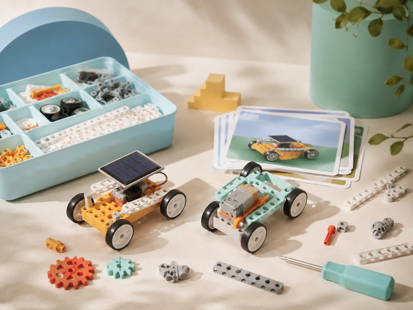 Solar & Motion Mini Cars educational science kit arranged on a studio table